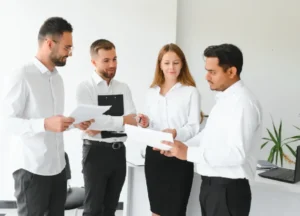 Business team analyzing supplier evaluation documents and criteria
