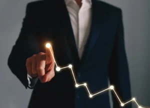 Quality assurance or procurement manager pointing to trend graphs or performance results

