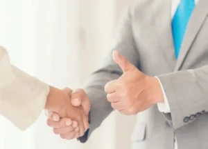 Businesspeople shaking hands or agreeing to a deal

