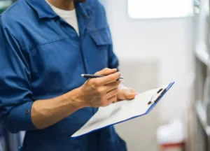 Technician writing or signing a certificate