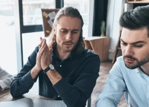 Person looking thoughtfully or suspiciously at documents