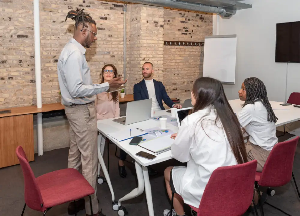 Employees participating in a corporate training session measuring learning effectiveness


