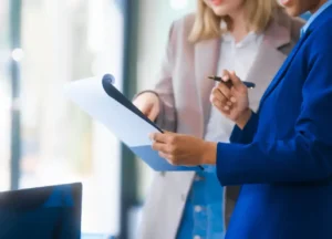 Audit team visiting a small business or checking a compliance document