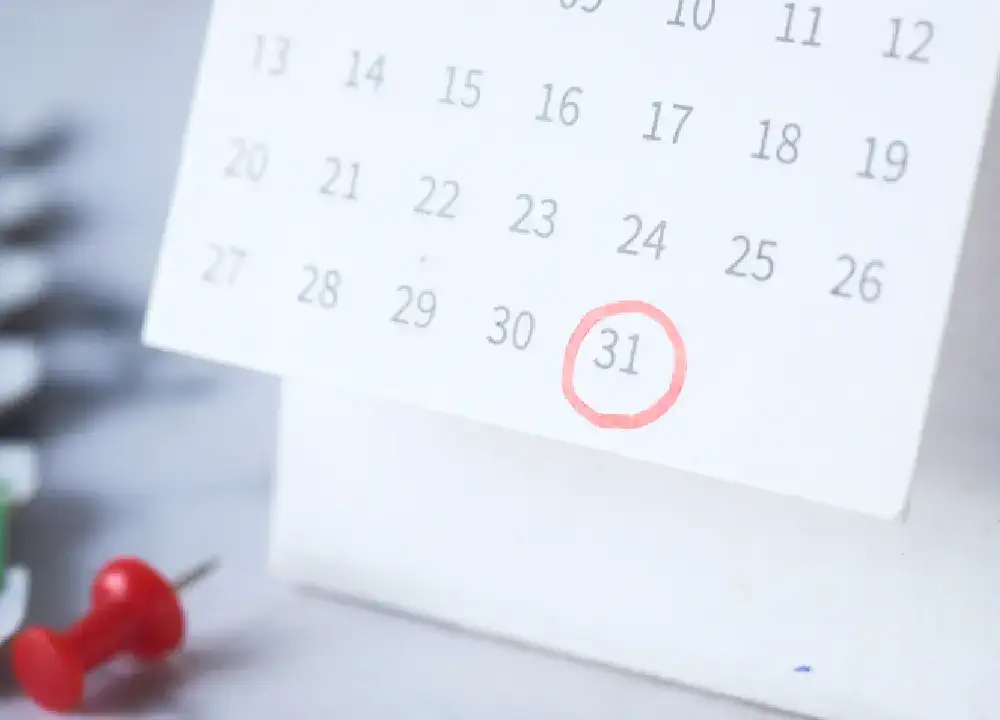 A calendar marked with a red circle - rescheduling ISO audits