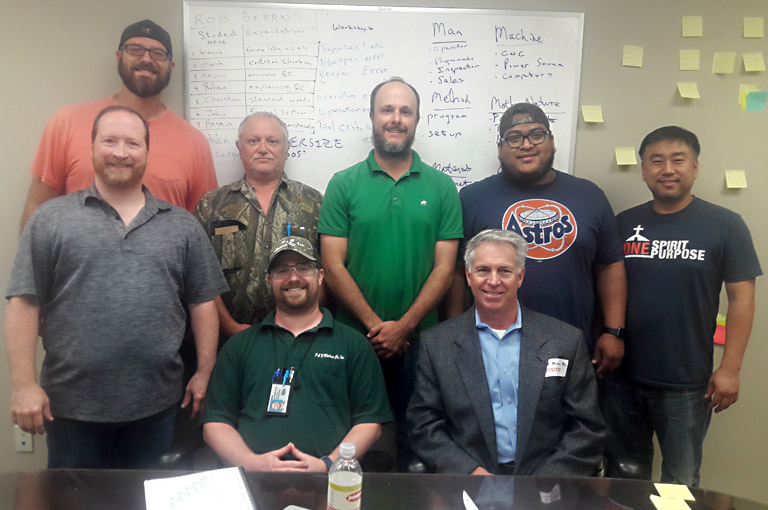 Mireaux’s instructor, R. Berrns, poses with the P&N Machine Shop team after a full day of Root Cause Analysis Training.