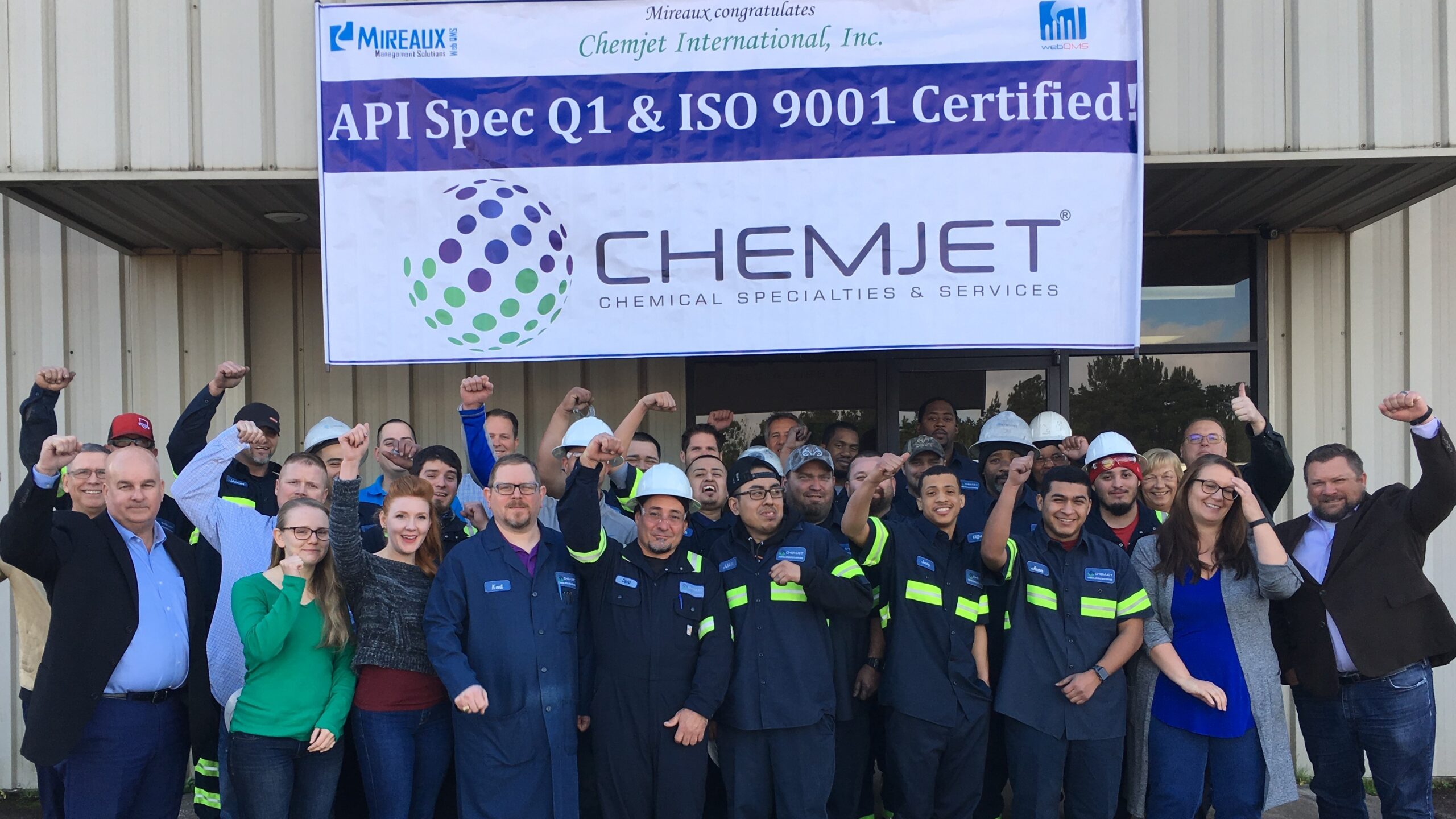 Team celebrating ISO and API certification